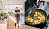 Ett ljust kök, en person står vid diskhon och en panna med stekt gnocchi och salvia.