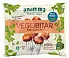 Förpackning av Anamma vegobitar med två bitar på gafflar och grön dekor.